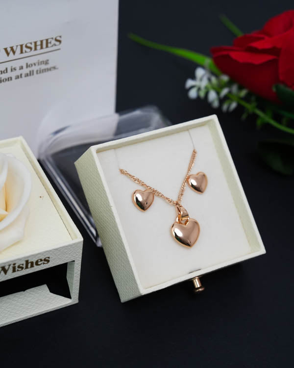 Cofre Rosa Eterna + Collar y Aretes Corazón (Acero inoxidable con baño de oro rosa) + Bolsa de regalo + 1 Rosa