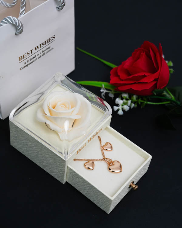 Cofre Rosa Eterna + Collar y Aretes Corazón (Acero inoxidable con baño de oro rosa) + Bolsa de regalo + 1 Rosa