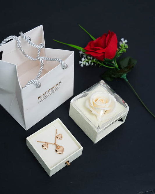 Cofre Rosa Eterna + Collar y Aretes Corazón (Acero inoxidable con baño de oro rosa) + Bolsa de regalo + 1 Rosa